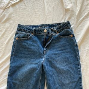 High waisted, straight leg, distressed blue jeans